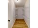 Walk-in closet with built-in shelving and wood floors at 1274 Oakbrook Ln, Denver, NC 28037