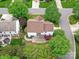 Aerial view of property showing backyard patio, mature trees, landscaping, and privacy at 135 Coronilla Rd, Mooresville, NC 28117