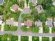 Aerial view of a home nestled in a neighborhood featuring mature trees and well-maintained yards at 135 Coronilla Rd, Mooresville, NC 28117