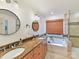 Elegant bathroom with double sinks, granite countertop, soaking tub, and tiled glass shower at 135 Coronilla Rd, Mooresville, NC 28117
