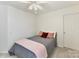 Simple bedroom with a plush gray bedding, two pillows, and a bright window at 135 Coronilla Rd, Mooresville, NC 28117