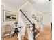 Charming foyer with hardwood floors, staircase, and views into other living spaces at 135 Coronilla Rd, Mooresville, NC 28117