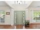 Spacious foyer featuring a tall ceiling, ample natural light, and classic architectural details and trim at 135 Coronilla Rd, Mooresville, NC 28117