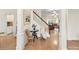 Inviting foyer with hardwood floors, staircase, and decorative accents that adds charm and character to the home at 135 Coronilla Rd, Mooresville, NC 28117