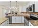 Bright kitchen with stainless appliances, granite counter tops, and an open concept design at 135 Coronilla Rd, Mooresville, NC 28117