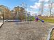 Community playground with swings, slide, and climbing structure, providing a fun outdoor space at 135 Coronilla Rd, Mooresville, NC 28117