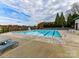 Community swimming pool features lap lanes, lounge chairs, and a lifeguard stand at 135 Coronilla Rd, Mooresville, NC 28117