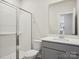 Bathroom featuring a shower, white toilet and a gray vanity with a white countertop at 140 Shepherds Landing Dr, Mooresville, NC 28115