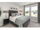 Bedroom with a large window, a bed with decorative pillows and 2 side tables at 140 Shepherds Landing Dr, Mooresville, NC 28115