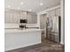 Modern kitchen with stainless steel appliances, white countertops and grey cabinets at 140 Shepherds Landing Dr, Mooresville, NC 28115
