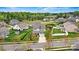 Expansive aerial view of neighborhood showcasing the house, its well-maintained lawn, and surrounding greenery at 1617 Post Ct, Gastonia, NC 28054
