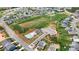 Aerial view of the community featuring a pool, a club house, and numerous single-Gathering homes at 1617 Post Ct, Gastonia, NC 28054