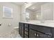 Bathroom featuring double sinks, natural light, large mirror, and tiled floors at 1617 Post Ct, Gastonia, NC 28054