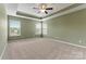 Bright and airy bedroom features plush carpeting and soft green walls, creating a calm and relaxing space at 1617 Post Ct, Gastonia, NC 28054