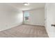 Neutral carpeted bedroom with a single window bringing in natural light at 1617 Post Ct, Gastonia, NC 28054
