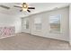 Cozy upstairs bonus room offers a versatile space with a ceiling fan and natural light at 1617 Post Ct, Gastonia, NC 28054