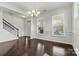 Bright dining room with hardwood flooring and decorative chandelier at 1617 Post Ct, Gastonia, NC 28054