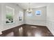 Spacious dining room with hardwood flooring, wainscoting, and large windows at 1617 Post Ct, Gastonia, NC 28054