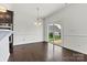 Bright dining room with hardwood floors, modern chandelier, and sliding glass doors to the backyard at 1617 Post Ct, Gastonia, NC 28054