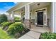 Inviting front porch with stone pillars, decorative lights, and well-maintained landscaping adds curb appeal at 1617 Post Ct, Gastonia, NC 28054
