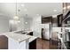 Kitchen with stainless steel appliances, center island with seating, and hardwood flooring at 1617 Post Ct, Gastonia, NC 28054