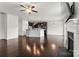 Open-concept kitchen and living area with dark wood floors and center island at 1617 Post Ct, Gastonia, NC 28054