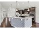 Kitchen with stainless steel appliances, center island with seating, and hardwood flooring at 1617 Post Ct, Gastonia, NC 28054