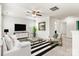 Stylish living room features designer furniture, a modern ceiling fan, and a large TV at 1617 Post Ct, Gastonia, NC 28054