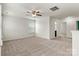 Spacious living room features plush carpeting and ceiling fan for comfortable living at 1617 Post Ct, Gastonia, NC 28054