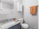Bright bathroom featuring granite countertop, vanity, a toilet, and a mirror at 1620#F Arlyn Cir, Charlotte, NC 28213