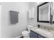 Bathroom featuring granite countertops, gray cabinets, a mirror, and a toilet at 1620#F Arlyn Cir, Charlotte, NC 28213