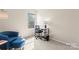 Inviting bedroom with large window, work space and neutral walls at 1620#F Arlyn Cir, Charlotte, NC 28213