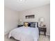 Cozy bedroom featuring modern decor, bedside tables, and stylish lamps at 1620#F Arlyn Cir, Charlotte, NC 28213