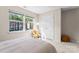 Bedroom with plenty of sunlight features two windows and a white closet at 1620#F Arlyn Cir, Charlotte, NC 28213