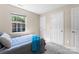 Bedroom with two white doors featuring a sunny window at 1620#F Arlyn Cir, Charlotte, NC 28213