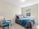Cozy bedroom featuring a bed, a chair, and a bright window at 1620#F Arlyn Cir, Charlotte, NC 28213