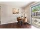 Eat-in dining area with wood table, chairs, and balcony access at 1620#F Arlyn Cir, Charlotte, NC 28213