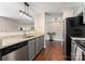 Modern kitchen featuring granite countertops and stainless steel appliances at 1620#F Arlyn Cir, Charlotte, NC 28213
