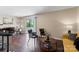 Bright and inviting living room with hardwood floors and access to a private balcony at 1620#F Arlyn Cir, Charlotte, NC 28213