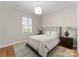 Bedroom featuring shuttered windows and hardwood floors at 17728 Jetton Green Loop, Cornelius, NC 28031