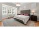 Bedroom with bay window and natural light, complemented by neutral tones and a spacious layout at 17728 Jetton Green Loop, Cornelius, NC 28031