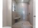 Glass enclosed tiled shower featuring a built-in seat and shower niche at 17728 Jetton Green Loop, Cornelius, NC 28031