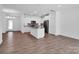 Open-concept kitchen with stainless steel appliances, granite countertops, and hardwood flooring at 1834 Teachers House Nw Rd, Concord, NC 28027