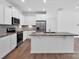 Modern kitchen with granite countertops, stainless steel appliances, and eat in nook at 1834 Teachers House Nw Rd, Concord, NC 28027