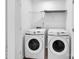 Modern laundry room featuring Samsung front loading washer and dryer at 1834 Teachers House Nw Rd, Concord, NC 28027