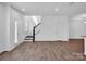 Open living space with wood floors, stairs, and ample natural light at 1834 Teachers House Nw Rd, Concord, NC 28027