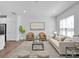 Bright living room featuring hardwood floors, natural light, and contemporary furnishings at 1834 Teachers House Nw Rd, Concord, NC 28027