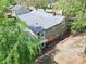Home with a backyard and lush, mature landscaping that provides shade and privacy at 2106 4Th Ne St, Hickory, NC 28601