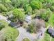 Home highlighting its setting among beautiful trees and gardens, enhanced by the street access at 2106 4Th Ne St, Hickory, NC 28601