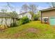 Backyard featuring a detached garage and lush lawn, offering ample space for outdoor activities and potential landscaping projects at 2106 4Th Ne St, Hickory, NC 28601
